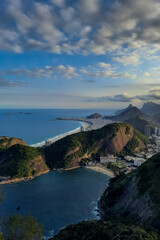 Fototapeta premium Touristic view of the city of Rio de Janeiro at sunset, from the top of the Sugar Loaf Mountain. Brazil
