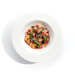 Tuna Cannelloni pasta - noodles plate with tuna fish meat. Pasta dish with tuna, tomato sauce and rocket salad. Restaurant gourmet cannelloni pasta food plate isolated on white background..