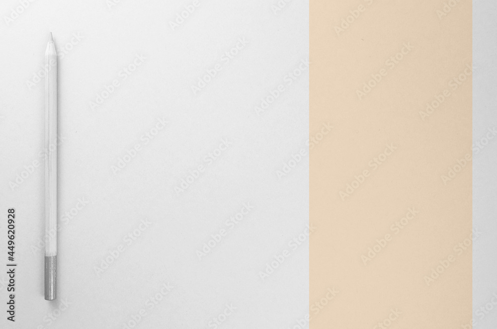 Sticker Wooden grey pencil on white and beige paper background with free space for text