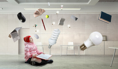 Little girl reading a book