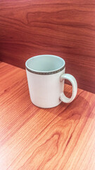 Empty cup on wooden table