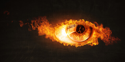 Macro image of human eye with fire flames