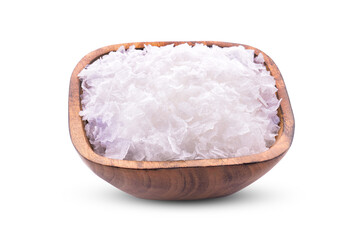 Salt (salt flowers) in a wooden bowl isolated on white background.
