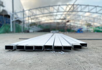 Close up view and low light. The end of steel rod white paint placed on ground. For building construction in the outdoor.