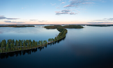 Beautiful ridge road between lakes in Saimaa in summer in Finland.