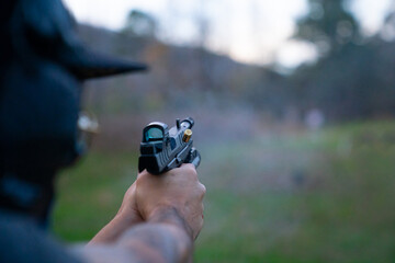 Person firing a handgun