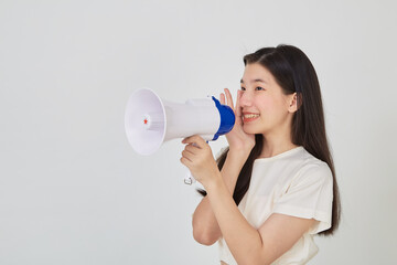young pretty Asian woman holding megaphone