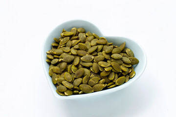 Pumpkin seeds on a white background