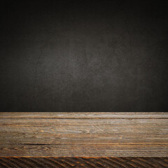 The background is blank wooden boards and a textured plastered wall with lighting and vignetting.