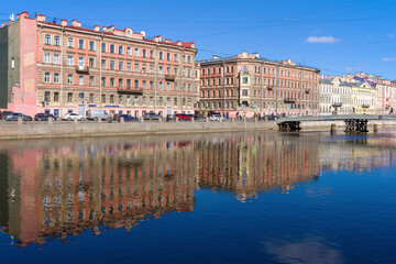 Embankment of the Fontanka river in the Senniy market area on a sunny March day , Saint Petersburg