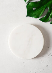 White cosmetic background with stone empty space