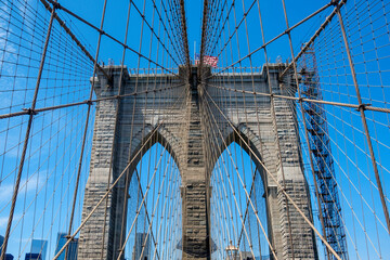 Brooklyn Bridge against blue sky