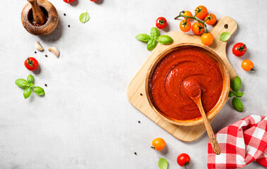 Classic homemade Italian tomato sauce with basil for pasta and pizza. Light gray stone  background. top view - 449628972
