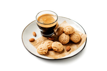 Cup of black coffee with amaretti cookies isolated on white background.