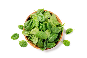 Fresh spinach leaves on wooden plate. Healthy vegan food. Top view. isolated on white background. - obrazy, fototapety, plakaty