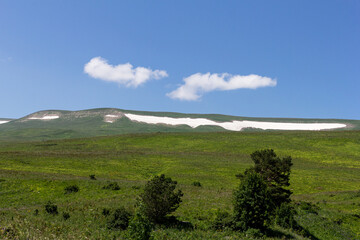 Panoramic views from mountain routes on a sunny summer day, walking and communicating with nature.