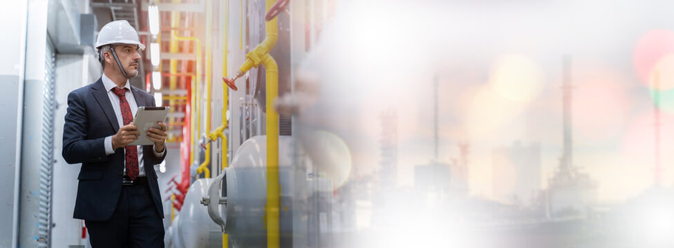 Electrical Engineer working front HVAC control panels, Technician daily check solar cell controls system for security functions in service room at factory.Energy,Ventilation,Air Conditioning.