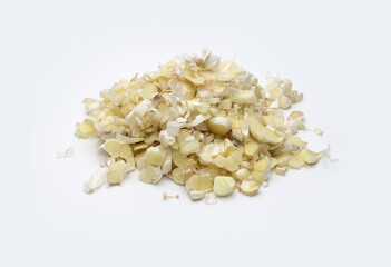 Pile of sliced and peeled garlic on an isolated white background