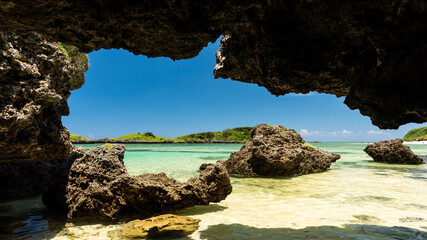 Gorgeous view from a whale shark shape cave. Stunning emerald green sea, green islets, rocks...