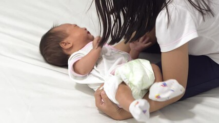 Sister try to cuddle new born baby. Sibling love