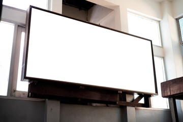 Mock up blank perspective horizontal billboard with clipping path on the wall near entrance in building