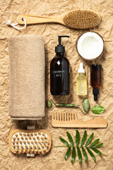 Natural cosmetic SPA products on crumpled paper background, top view. Organic beauty product...