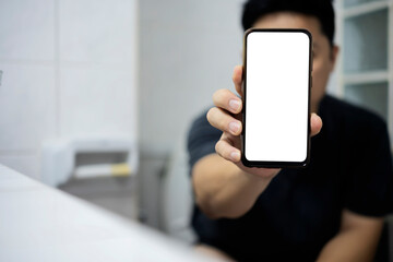 Smart phone with white screen background in toilet, restroom or WC.