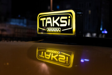 Close-up of Istanbul taxi at night. The word 