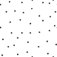 Seamless abstract pattern of little black shabby dots or spots on white.