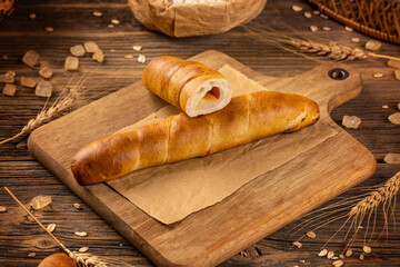 Bun with ham and cheese