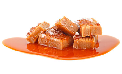 Delicious candies with caramel sauce and salt isolated on a white background