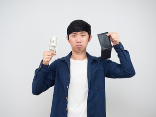 Asian man holding money dollar and wallet sad face white background poor man concept