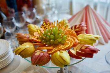 Delicious fruits appetizers, desserts on stand, modern sweet tab