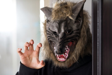 Mam with wolfwere mask. Halloween costume