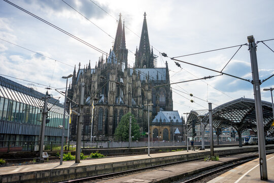 Cologne, Germany - May 21, 2018: Snapshot from the deutsche bahn railway staion with domo cathedral in Domplatte, Cologne, Deutschland