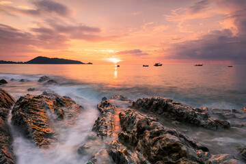 Motion seascape at sunset at Kalim beach, Phuket