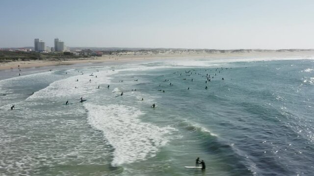 Baleal, Portugal, Europe. People floating within foamy waves
