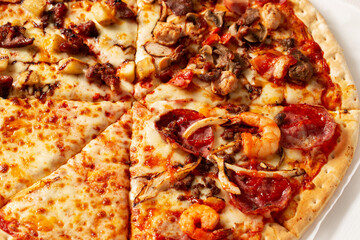 pizza with salami and tomatoes