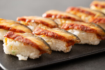 Seasoned eel sushi on a plate