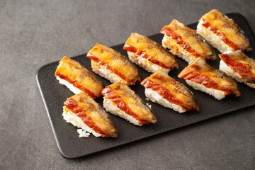 Seasoned eel sushi on a plate