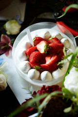 Fresh raw strawberries on a whipped cream cake