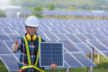 solar power station,Solar panels with technician,Future electrical production, asian engineers