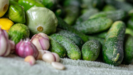 color photo with autumn vegetables on the table, different colors, shapes and types of vegetables prepared for home canning, autumn harvest time