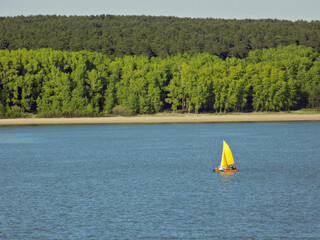 Yellow yacht on the river
