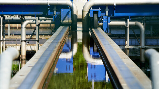 Detail from Wastewater treatment plant (Kl&auml;ranlage) in germany, blue steel construction with pipes and rails. Filters dirty water from water bodies.