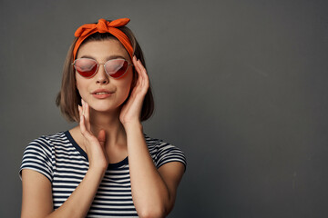 pretty woman wearing sunglasses posing fashion in modern style