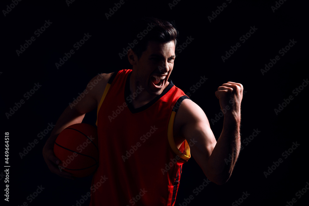 Sticker Basketball player with ball on black background