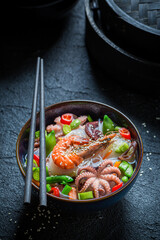 Tasty seafood noodle with octopus and shrimps. Asian cuisine.