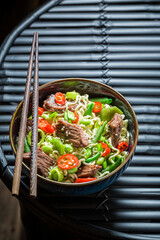 Tasty asian noodle with vegetables and beef. Classic seafood noodle.