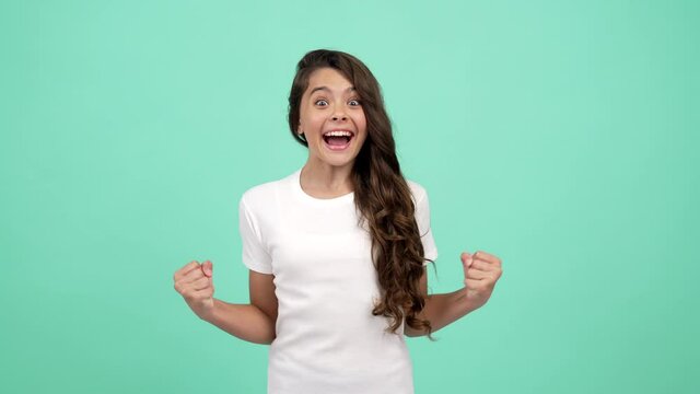 portrait of happy child long curly hair celebrate success, happiness